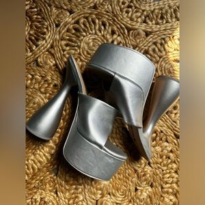 Silver platforms size 8. Can fit a 7.5. NWOT